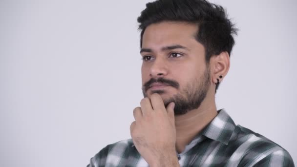 Portret van jonge gelukkig bebaarde Indier denken - Video