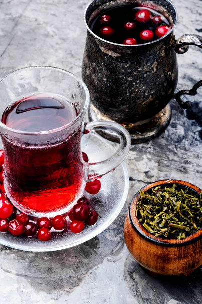 Cranberry tea in a glass cup.Winter hot tea - Photo, Image