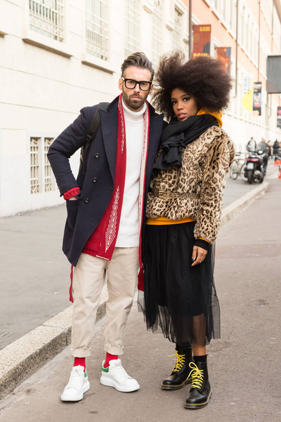MILAN, ITALY - JANUARY 12: Fashionable couple poses outside Magliano fashion show during Milan Men's Fashion Week on JANUARY 12, 2019 in Milan. - Fotó, kép