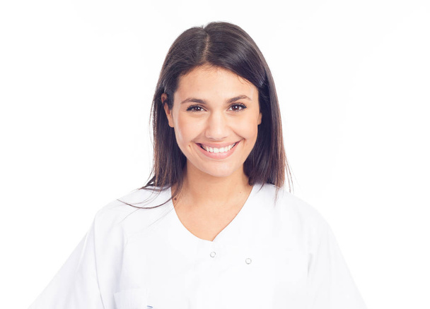 portrait of smiling nurse or brunette doctor in white coat - Фото, изображение
