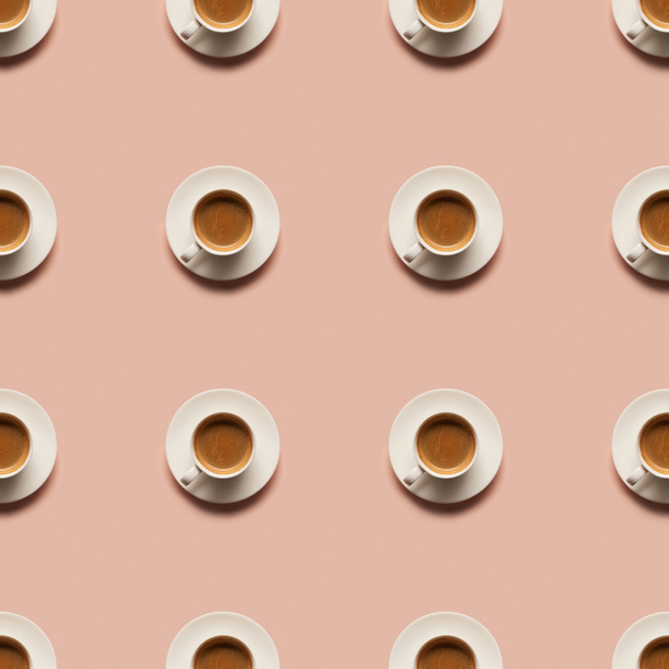 top view of aromatic coffee in cups isolated on pink  - Fotó, kép