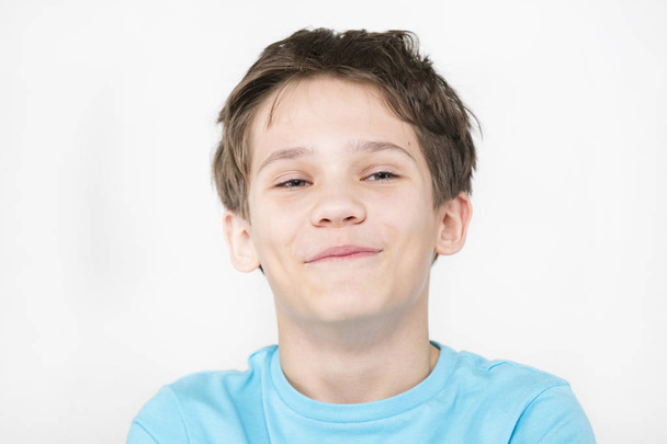 Portrait of an emotional boy on a white background. - Foto, immagini