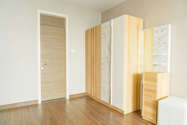 beautiful wooden wardrobe in a room - Фото, зображення
