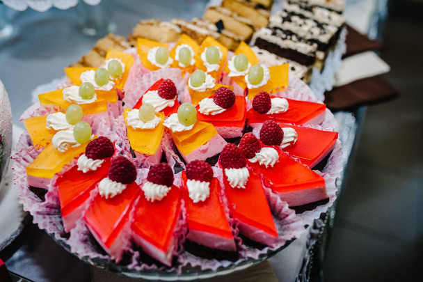 Sweet table with assorti of sweets on wedding holiday  - Фото, зображення