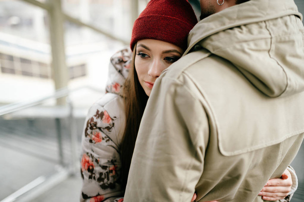 romantic couple in love hugging while standing on stairs - Valokuva, kuva