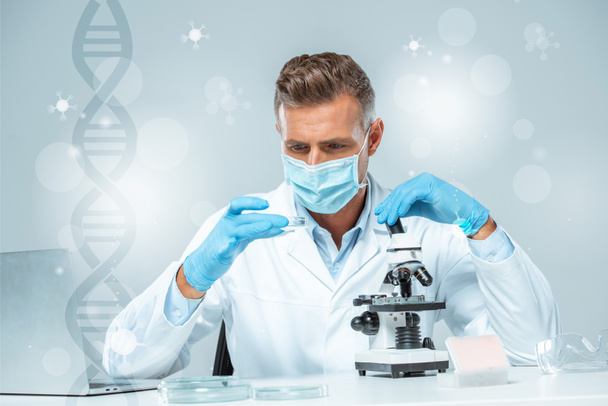 guapo científico en máscara médica y guantes médicos haciendo experimento con ADN
 - Foto, Imagen