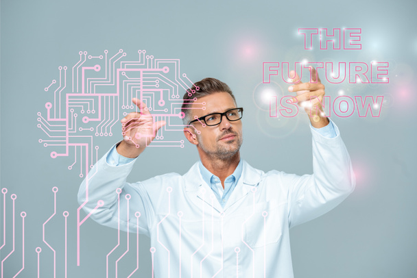 handsome scientist in white coat and glasses moving brain interface with "the future is now" lettering isolated on white, artificial intelligence concept - Photo, Image