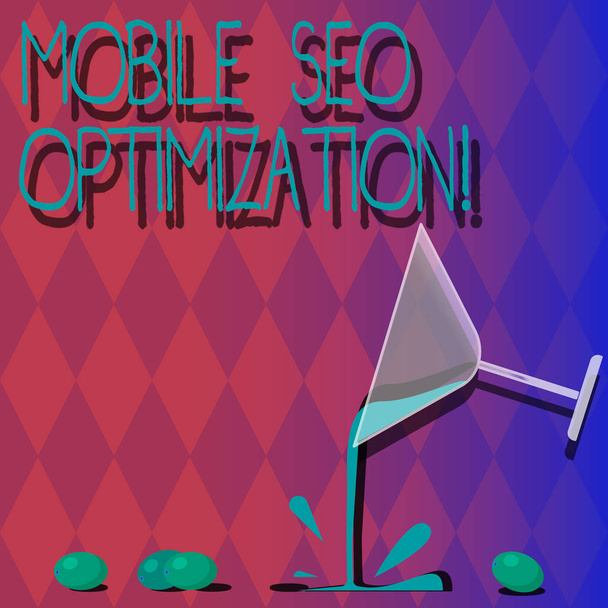 Handwriting text Mobile Seo Optimization. Concept meaning enables a website to rank for mobile searches Cocktail Wine Glass Pouring Liquid with Splash Grapes and Shadow photo. - Photo, Image