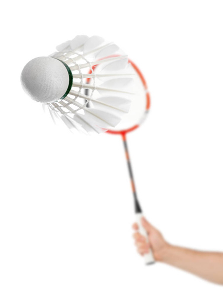 Hand with badminton racket and feather shuttlecock isolated on white background - Fotografie, Obrázek