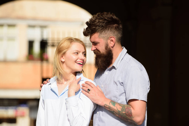 Feeling love and romance. Bearded man hug sexy girl. Sensual woman and man enjoy romantic date. Couple in love. Loving couple of woman and hipster dating outdoor. In love for the first time - Φωτογραφία, εικόνα