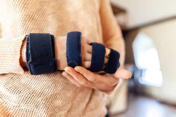 Medicinal arm sling on the right hand - Photo, Image
