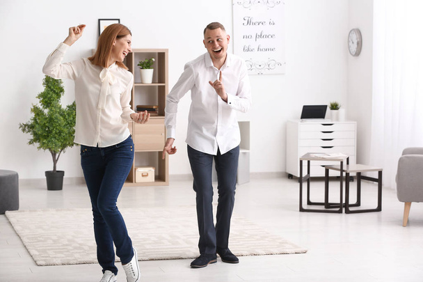 Beautiful couple dancing at home - Foto, Imagen
