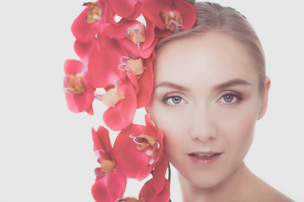 Young beauty woman with flower near face. - Fotoğraf, Görsel