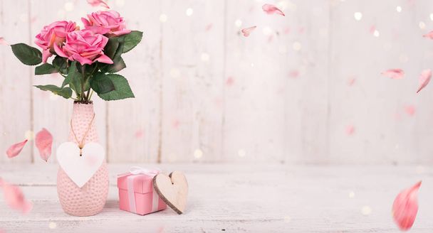 Flowers composition for Valentines, Mothers or Womens Day. Pink flowers on old white wooden background. - Fotó, kép