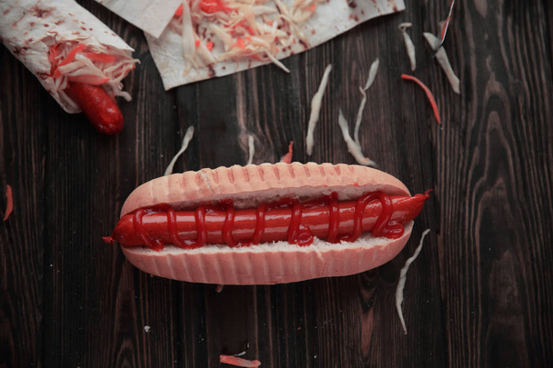 fast food.hot dogs with sauce on wooden background - Fotoğraf, Görsel