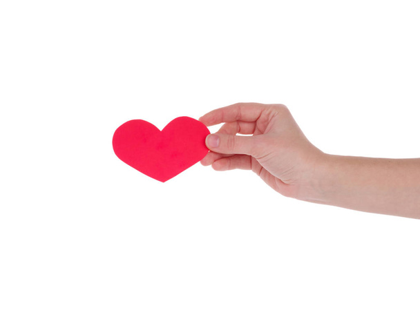 kezében egy piros heart.the fogalom, a szeretet, a Valentin-nap, a szimbólum és a romantikus. piros szív, ajándék - Fotó, kép