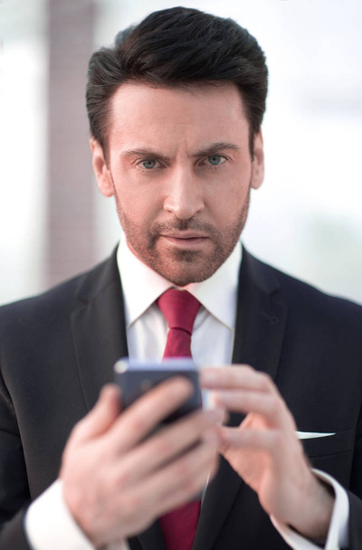 close up.businessman is typing SMS - Фото, изображение