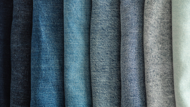 Jeans background.Jeans on a light background. Detail of nice blue jeans. Jeans texture or denim background. Blue denim jeans - Photo, Image
