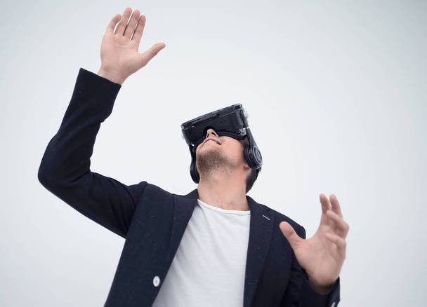 close up.young businessman in a virtual reality helmet. - Foto, Imagem