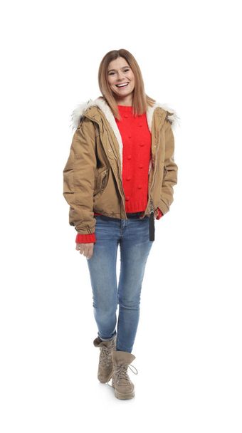 Young woman wearing warm clothes on white background. Ready for winter vacation - Φωτογραφία, εικόνα