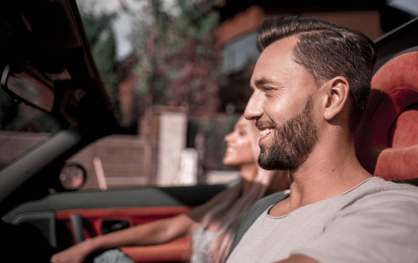 close up.handsome man driving a convertible car. - Φωτογραφία, εικόνα