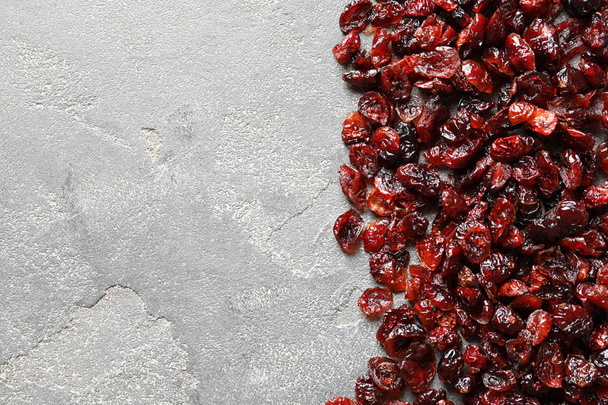 Cranberries on color background, top view with space for text. Dried fruit as healthy snack - Foto, immagini