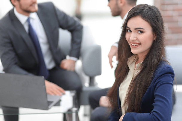 Portrait of smiling working girl in meeting. - Photo, image