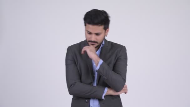 Young bearded Indian businessman thinking - Video, Çekim