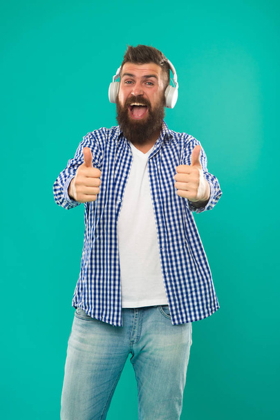 Excellent sound. Music library concept. Tech gadgets all music lovers should have. Music always with me. Man listening song in headphones. Best gifts for music lovers. Bearded hipster wear headphones - Foto, Imagen