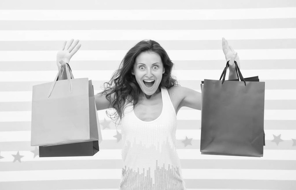 Feel free buy everything you want. Woman carries bunch shopping bags striped background. Finally bought favorite brand. Tips shop sales. Girl satisfied with shopping. Profitable purchase black friday - Fotoğraf, Görsel