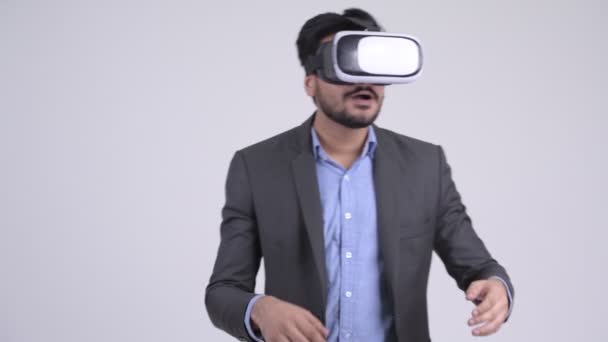Young bearded Indian businessman using virtual reality headset - Metraje, vídeo