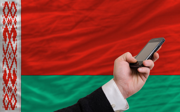 cell phone in front national flag of belarus - Photo, Image