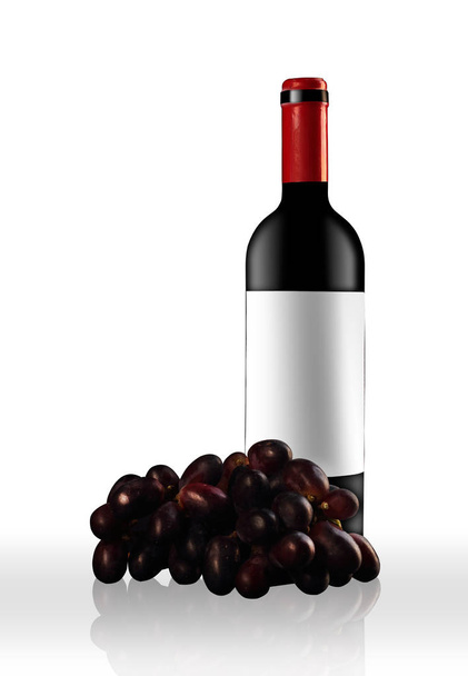 full red bottle with wine grapes - Foto, Imagem