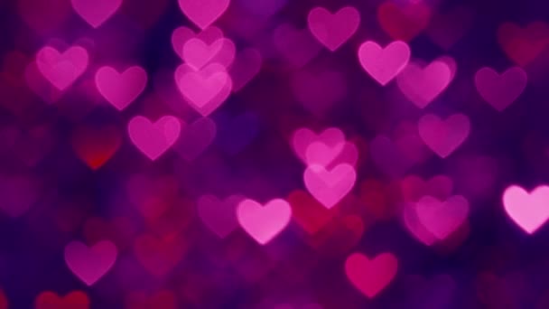 Abstrakcja serce bokeh tle purpurowy kolor - Materiał filmowy, wideo