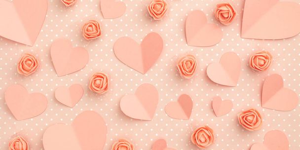Valentines day floral coral composition. Love Day concept with coral flowers rose and heart flat lay on living coral background. Mothers day, 8 March Women day. Top view. - Photo, Image