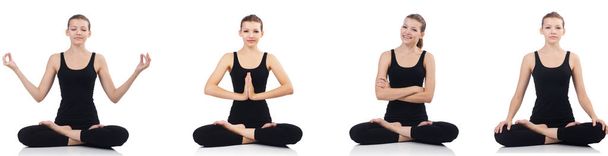 Young woman sitting cross-legged and doing yoga  - Photo, Image