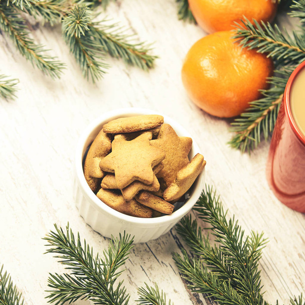 Gingerbread Cookie. Cup of coffee. Tangerines. New Year mood. - Fotoğraf, Görsel