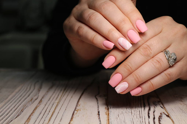 Beautiful woman's nails with beautiful christmas manicure studio - Photo, Image