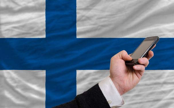 téléphone portable devant le drapeau national de la Finlande
 - Photo, image