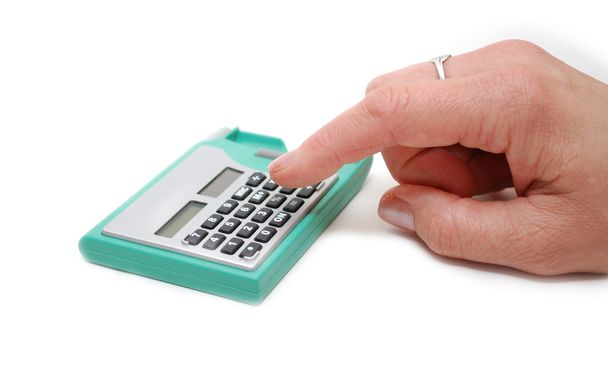 Mão apertando um botão na calculadora
 - Foto, Imagem