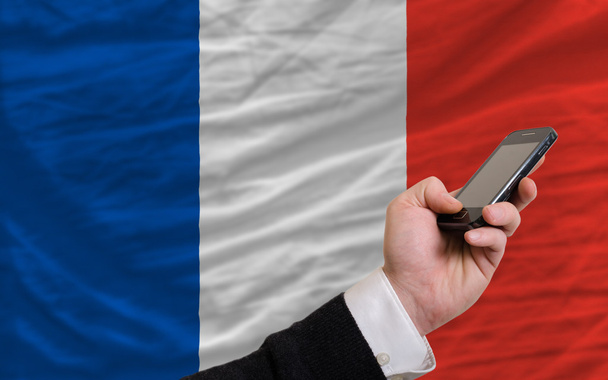 cell phone in front national flag of france - Photo, Image