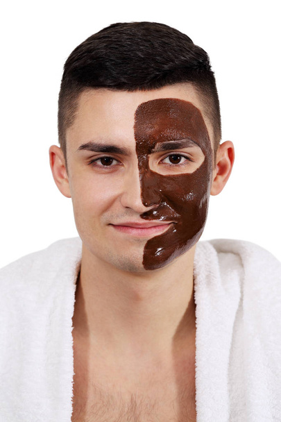 Hombre en toalla con una máscara en la cara
 - Foto, Imagen