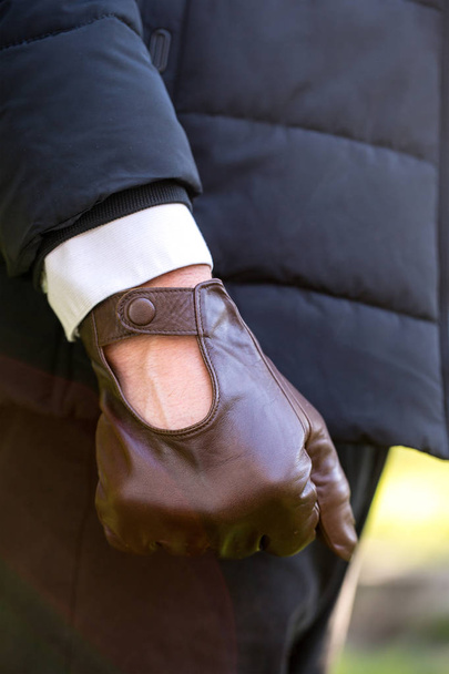Brown men's gloves made of genuine leather - Fotoğraf, Görsel