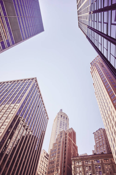 Modern and old New York buildings, color toning applied, USA. - 写真・画像