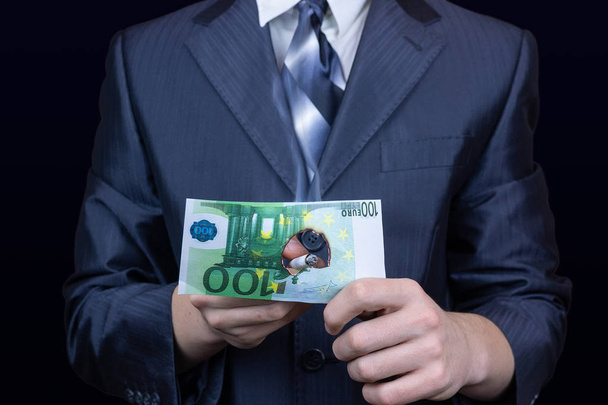 man sets fire to Euro banknote, cigarette, businessman burning money cigarette - 写真・画像