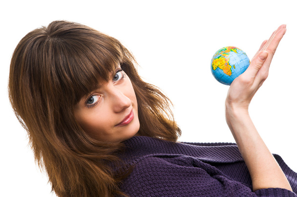 Young woman holds the globe - Valokuva, kuva