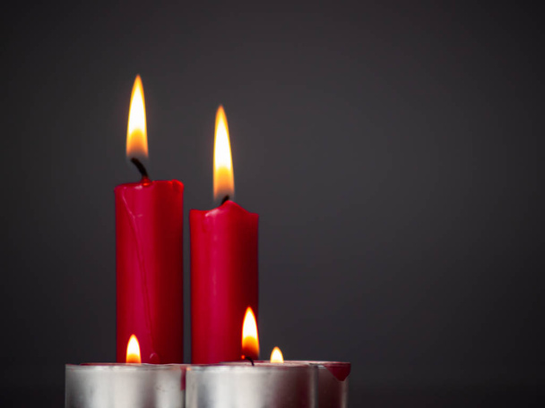 Concept of love Red candles lit with a gray background - Foto, immagini