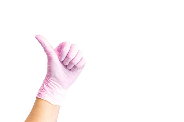 Naisten kädet valkoiset lääketieteelliset käsineet osoittavat kuin merkki
.  - Valokuva, kuva