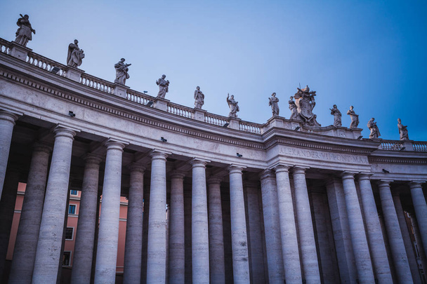 The Columns and statues in Saint Peter Square, near the Basilica of Saint Peter in Rome, Italy - Fotó, kép