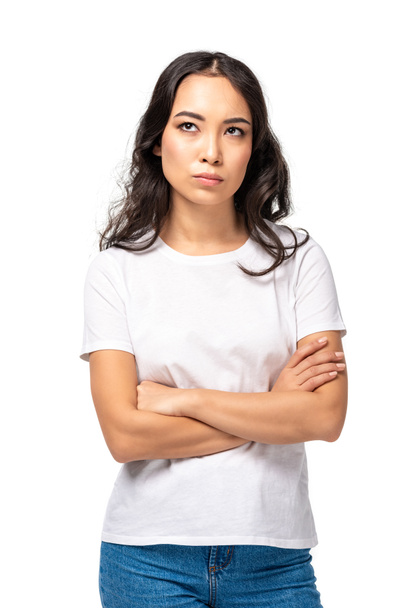 Skeptical dissatisfied asian woman standing with crossed arms isolated on white - Fotoğraf, Görsel